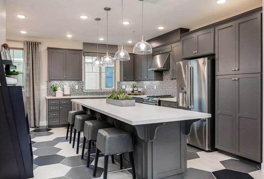 Kitchen with recessed lighting and grey cabinets