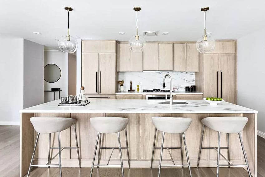 Modern kitchen with beige wood veneer cabinets and quartz countertops