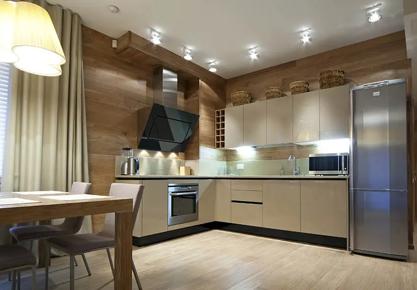 modern-l-shaped-kitchen-with-beige-gloss-cabinets-wood-panel-walls