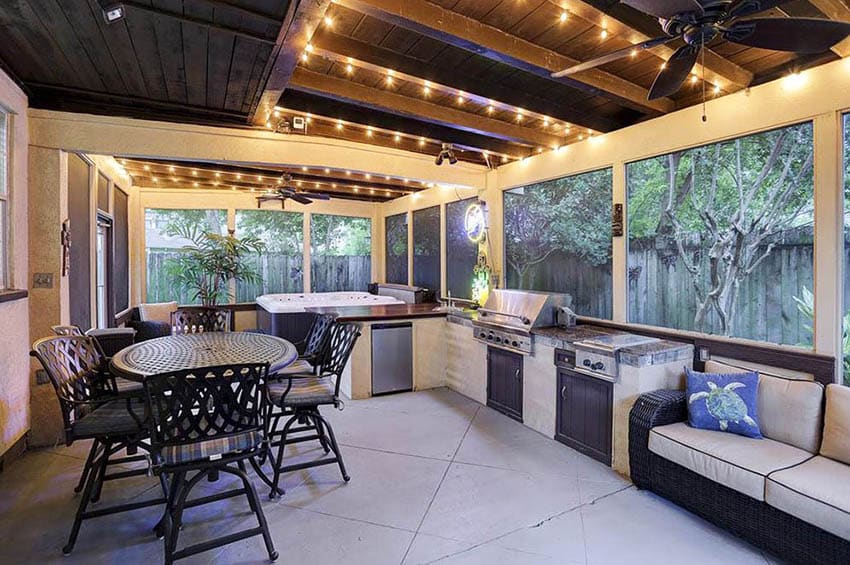 Backyard enclosure with outdoor cooking kitchen and dining seating