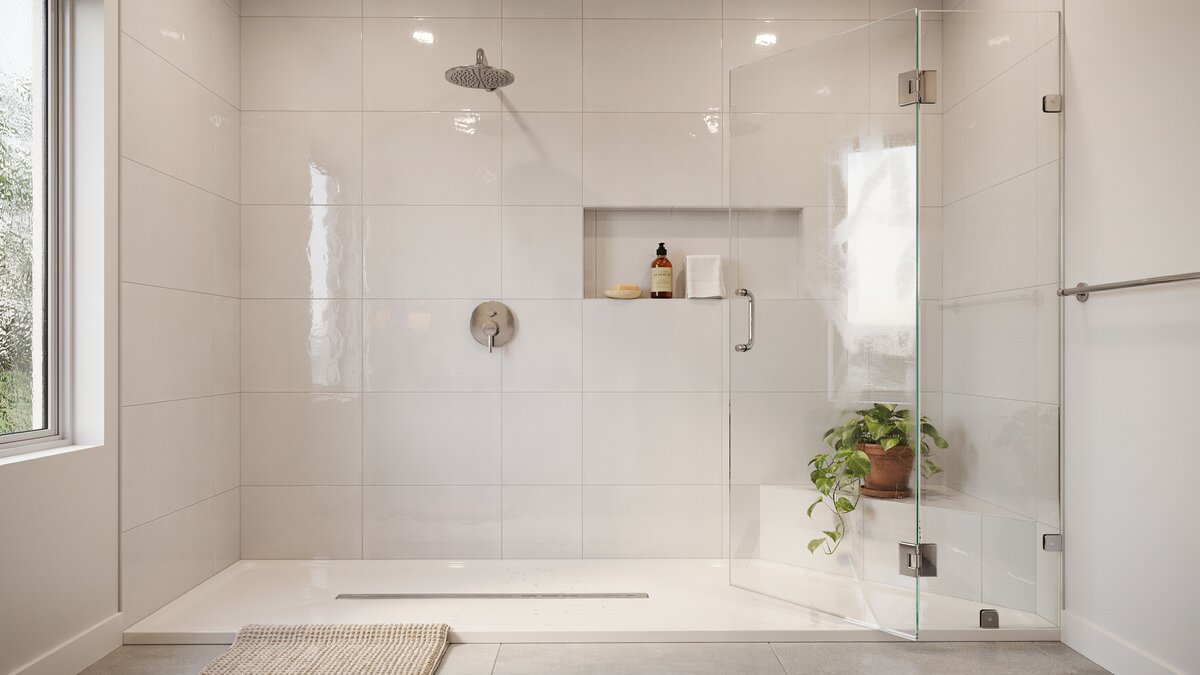 Glass shower lined with polished white ceramic tile and chrome fixtures