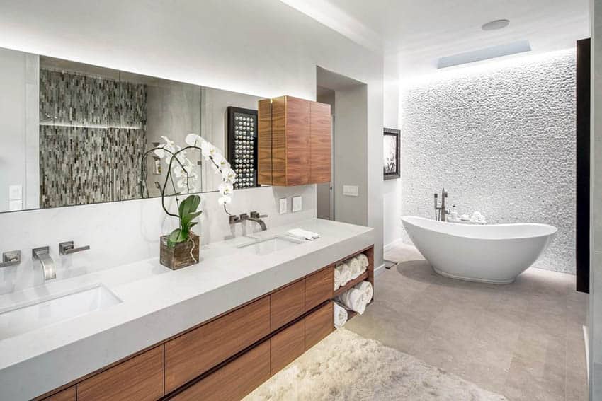 Bathroom with toilet privacy, elegant tub and textured accent wall