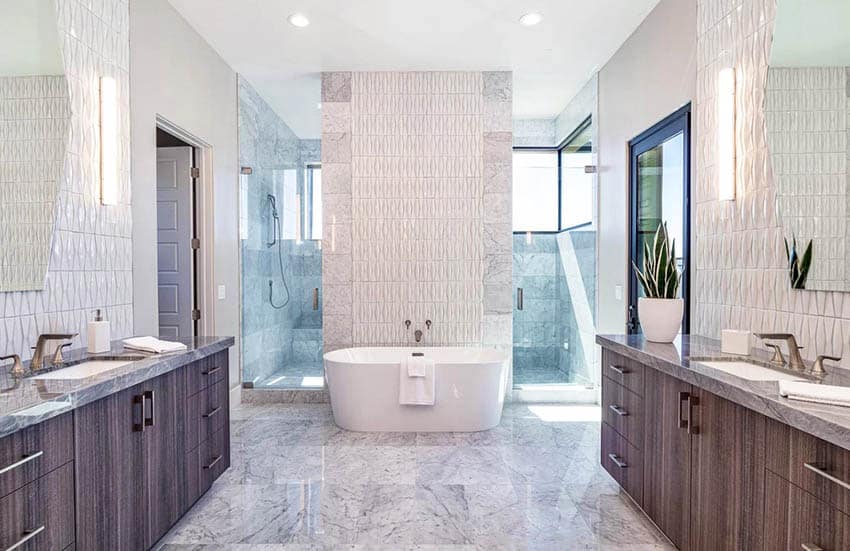 Beautiful master bathroom with freestanding tub and his and hers vanity sinks
