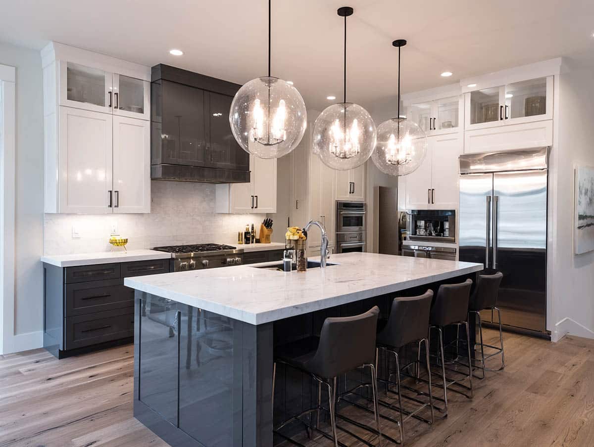 High gloss gunmetal on the lowers and island and crisp white for the upper cabinetry