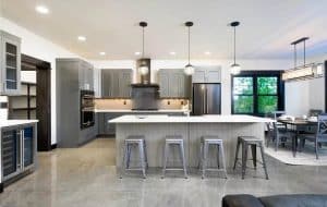 Contemporary Kitchen With Polished Concrete Flooring Gray Cabinets White Counters 300x190 