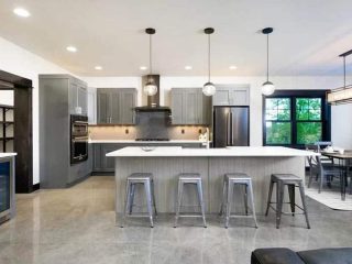 Contemporary kitchen with polished concrete flooring gray cabinets white counters