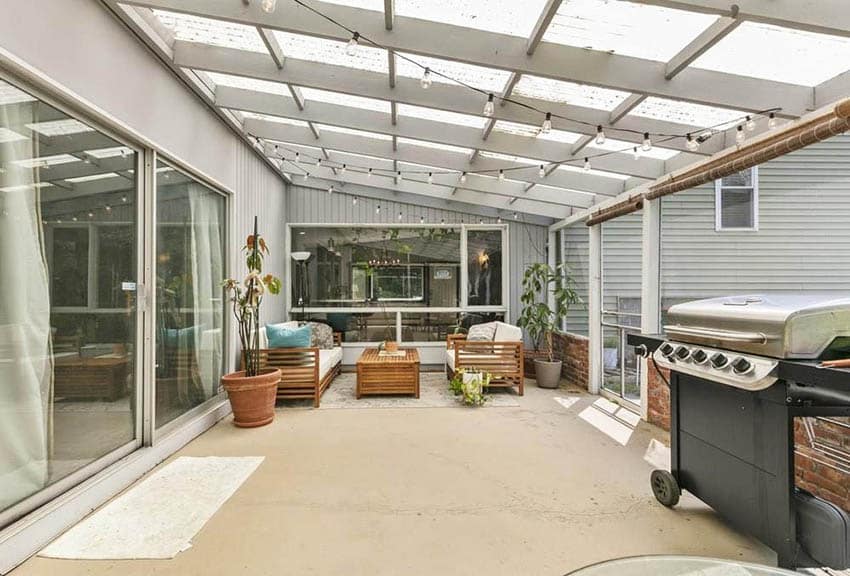 Patio with concrete flooring and grill