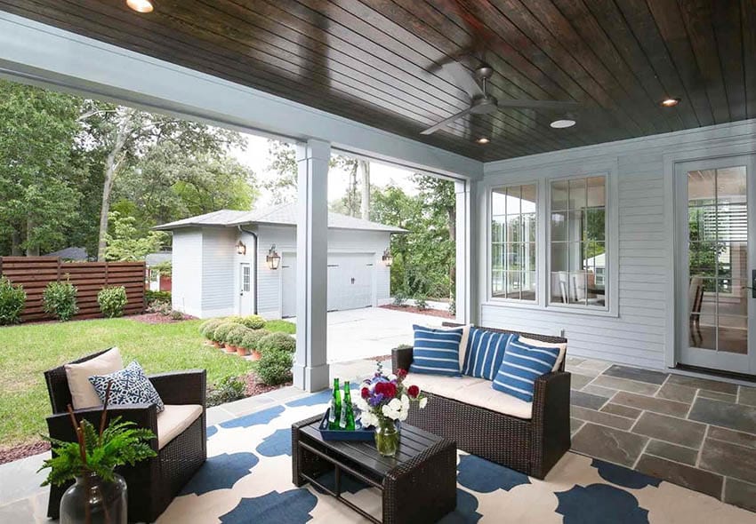 Patio with flagstone flooring and retractable screens