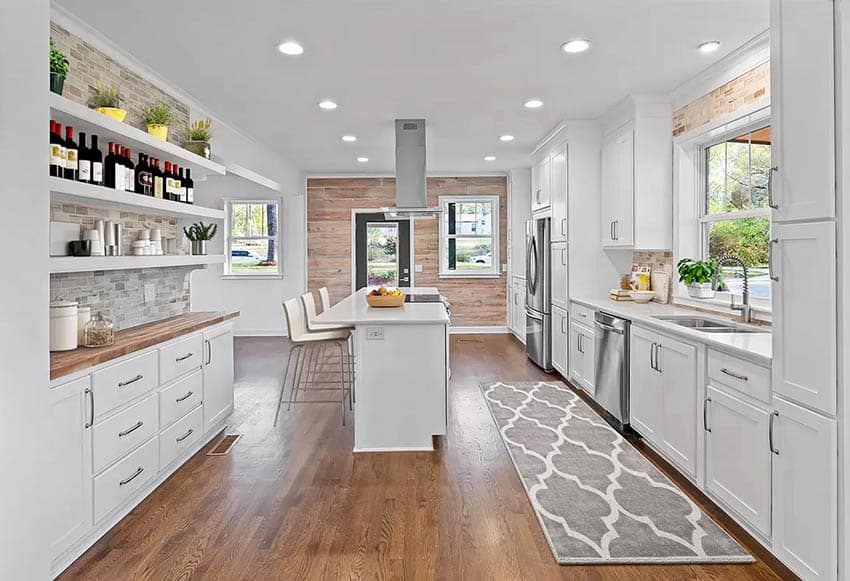 Kitchen bar with white cabinets open shelving wood countertops breakfast bar island