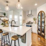 Kitchen with custom arched wood pantry door