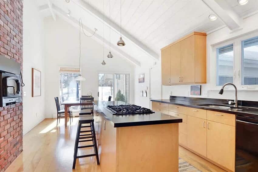 Kitchen with slope ceiling and pendant lights