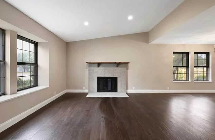 Living room with dark wood floors and beige paint