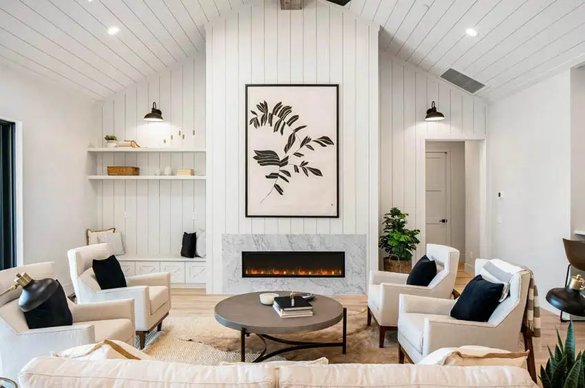Living room with shiplap vaulted ceiling gas fireplace
