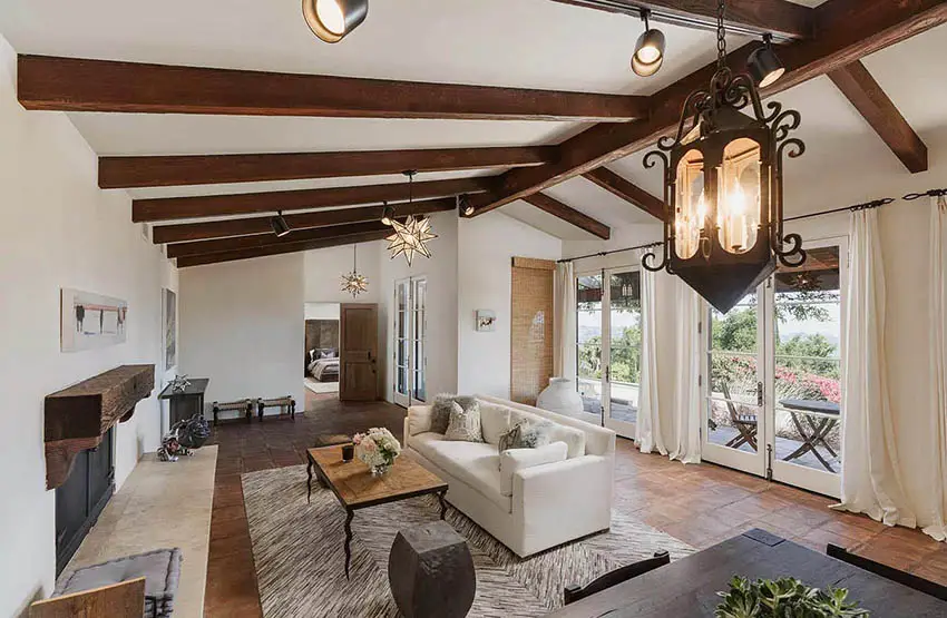 Living room with vaulted ceiling wood beams and french doors