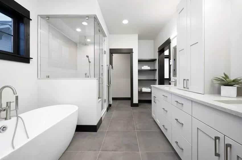 Master bathroom with steam shower and white vanity with dark wood window door frames