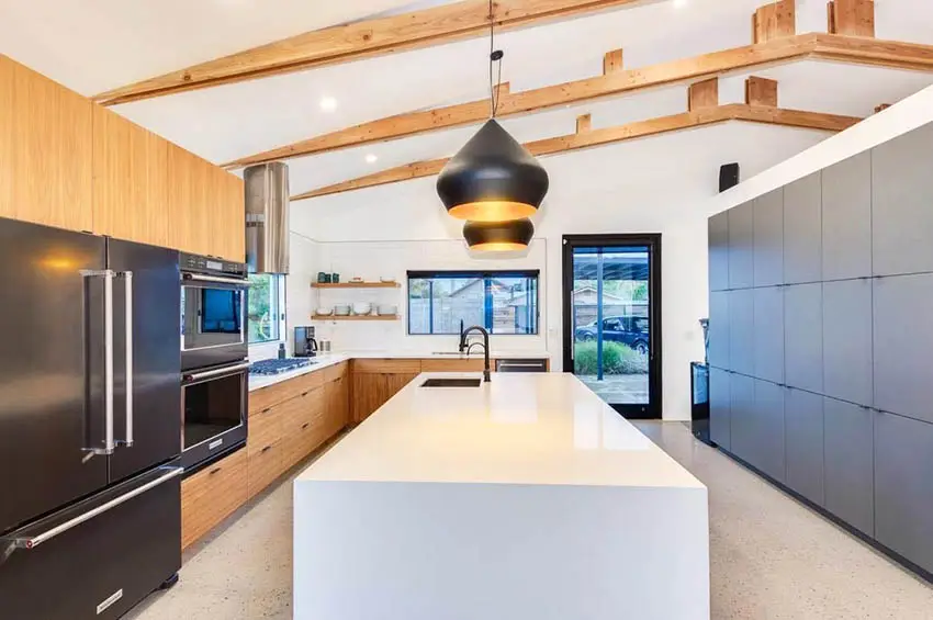 Modern kitchen with wood vaulted ceiling