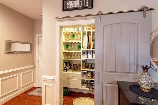 Rolling Pantry Door With Custom Storage Cabinetry 600x399 