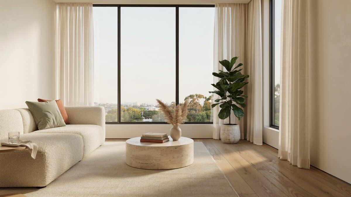 Solid oak floor in a sunroom with a wide window wall and cream sofa