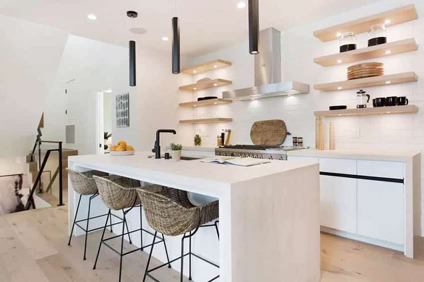 Staged kitchen design with cookbooks, cutting boards and fruit