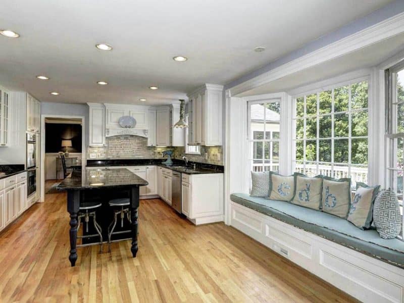 Traditional Kitchen With Bay Window Seat White Cabinets Rustic Island 800x600 