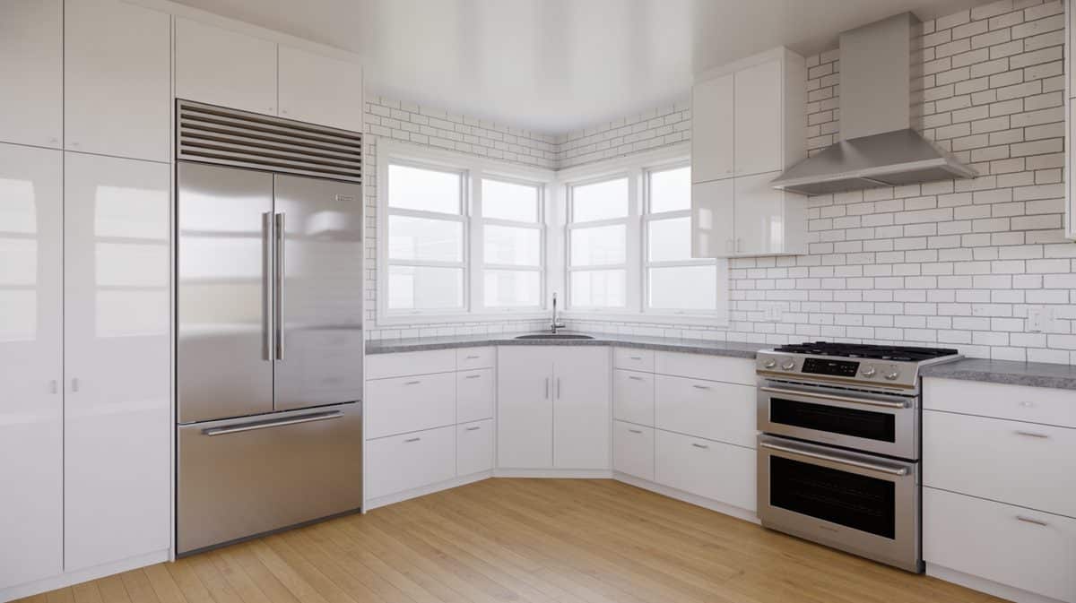 White high-gloss kitchen with stainless appliances, subway tile backsplash, and corner bay window at the sink