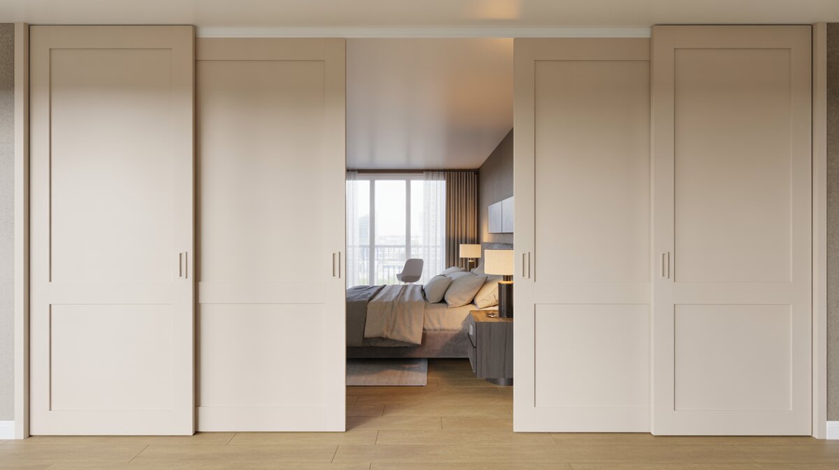 Cream sliding bypass closet doors opening to reveal a modern bedroom