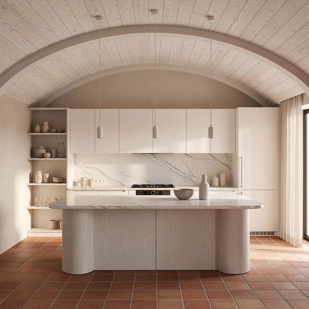 Kitchen using its arched vault to frame the space above the island and hang pendant lighting.
