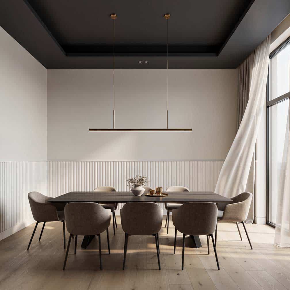 Elegant dining room with darker gray ceiling, greige walls, white paneling and a linear chandelier.