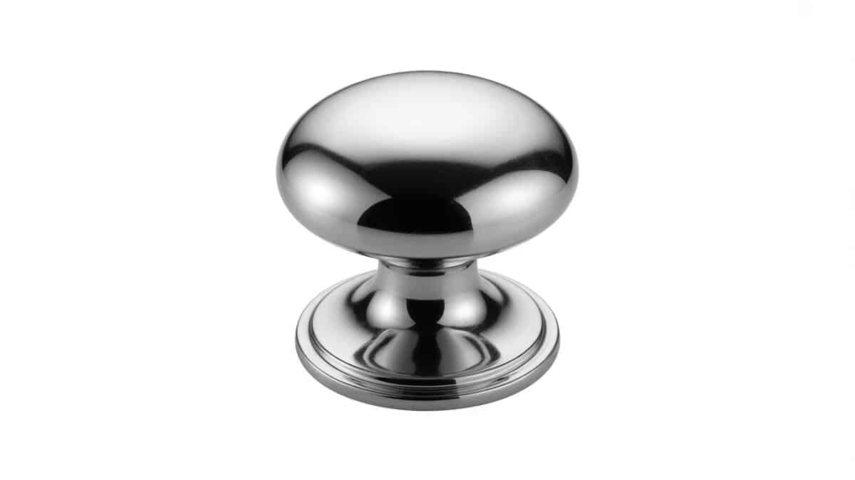 Round polished chrome cabinet knob with pedestal base on white background