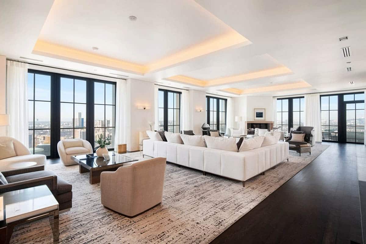 Contemporary living room with inverted ceiling and hidden accent lighting