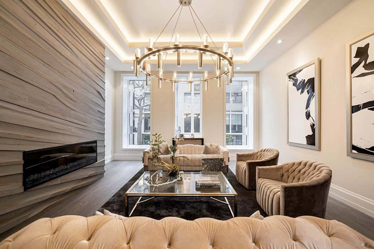 Stylish room with illuminated double step ceiling and quartz wall fireplace