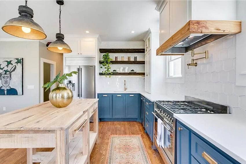 Kitchen with blue base cabinets and rustic wood island