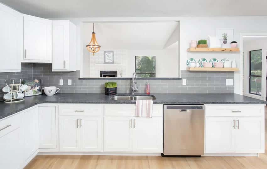 Farmhouse kitchen with white cupboards, dark gray quartz and coffee station