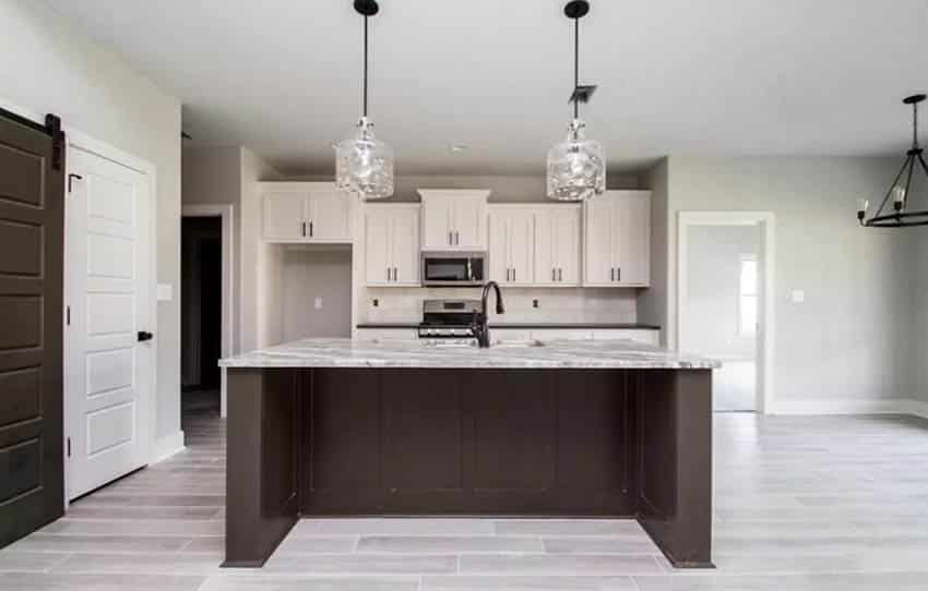 Gray hardwood flooring with light gray paint kitchen