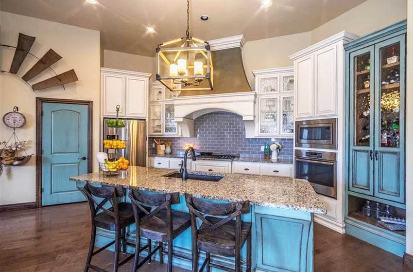 Kitchen island with aqua blue island with distressed paint beige granite countertops