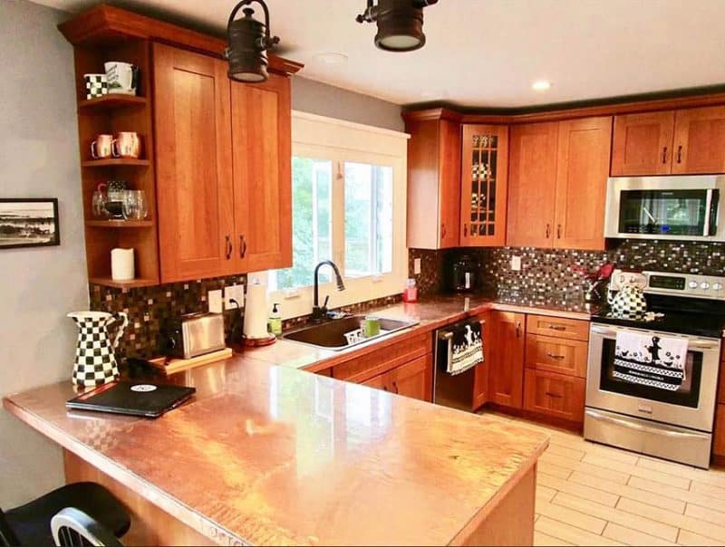 Copper Kitchen Countertops Pros Cons   Kitchen With Copper Countertop Peninsula Wood Cabinetry 800x604 