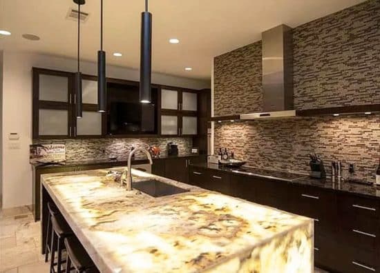 Kitchen With Onyx Countertops With Lights 550x396 