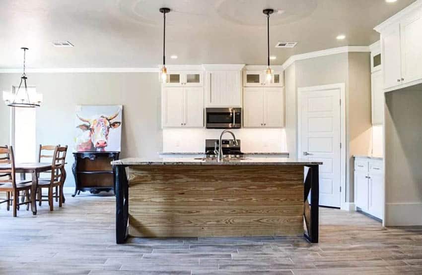 Kitchen with raw wood island white cabinets