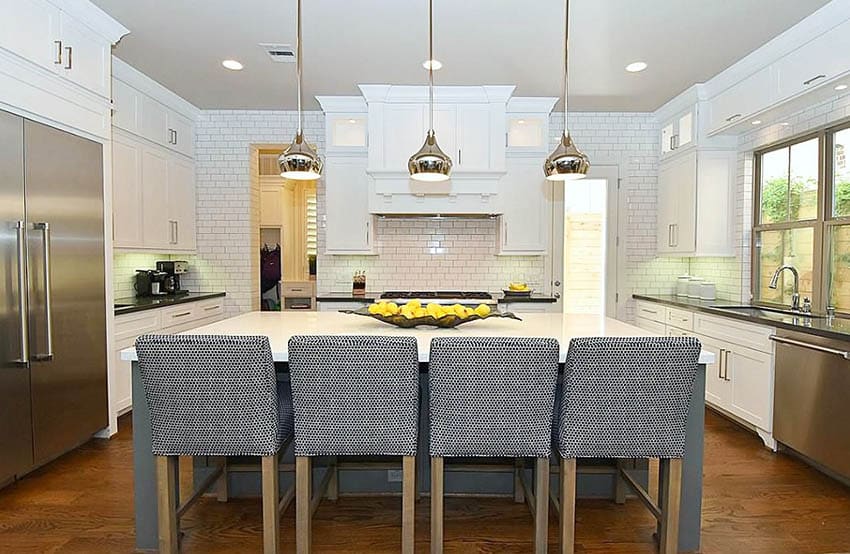 Kitchen with gray island, white countertop with fresh fruit display