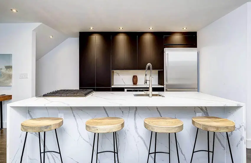Modern kitchen with cabinet depth refrigerator quartz island