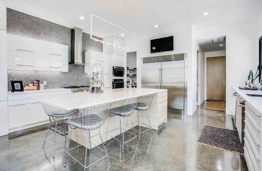 Modern kitchen with wood veneer island and countertop cookbooks