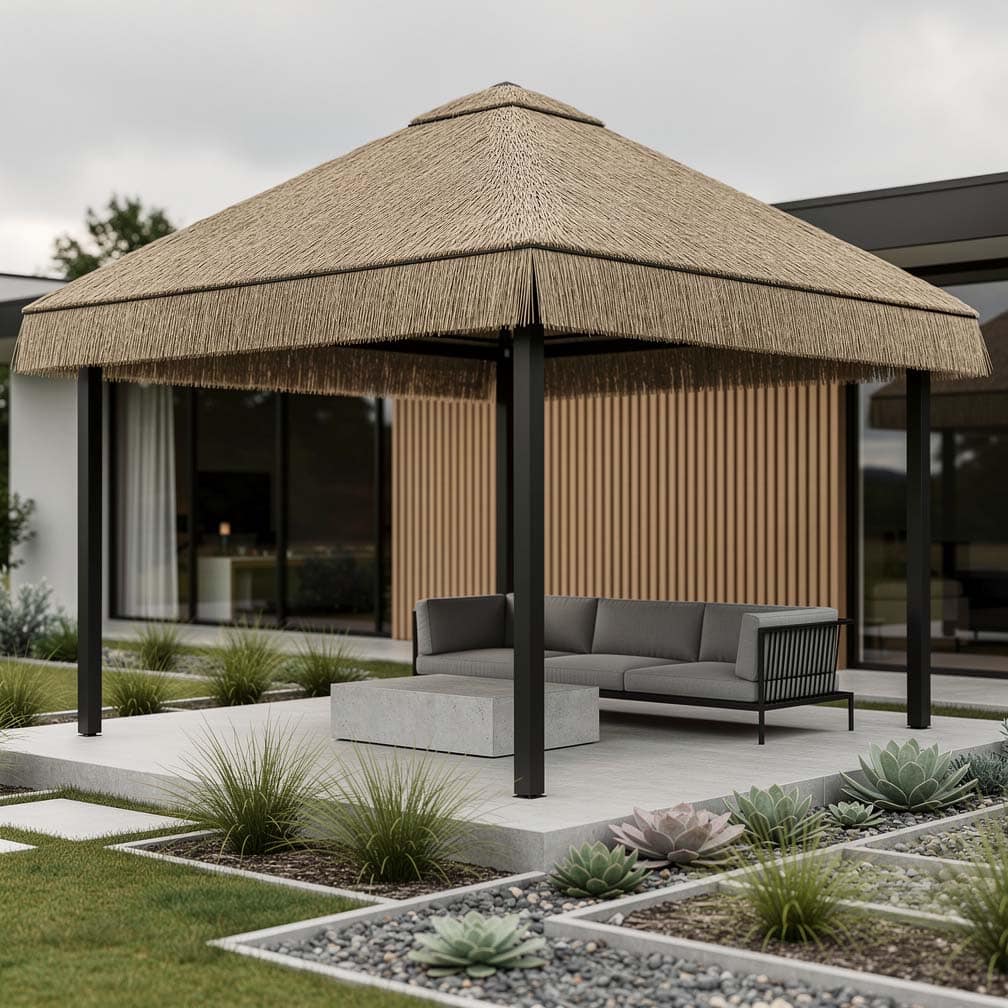 Minimalist thatch canopy over a gray sectional sofa on a concrete patio