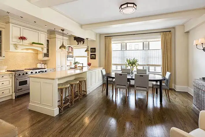 Open concept kitchen with cream cabinets 