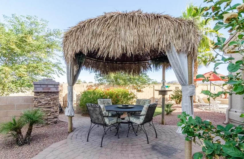 Palapa with curtains and sitting area