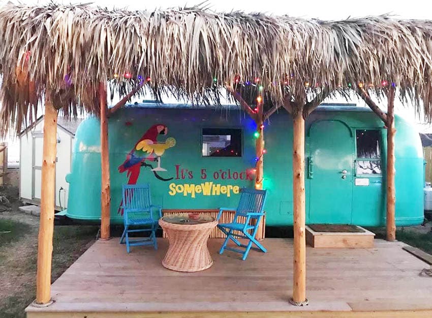 Palapa with deck next to travel trailer