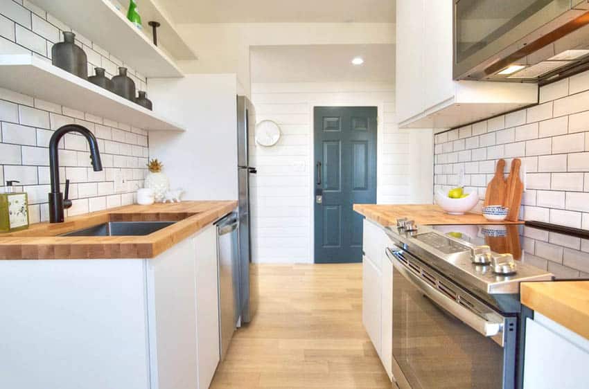 Small galley kitchen with butcher block counters cutting boards decor