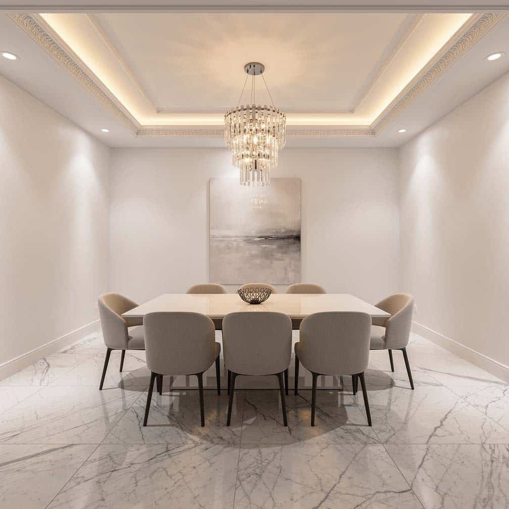 Ceiling with decorative tin trim and molding paired with a crystal chandelier.