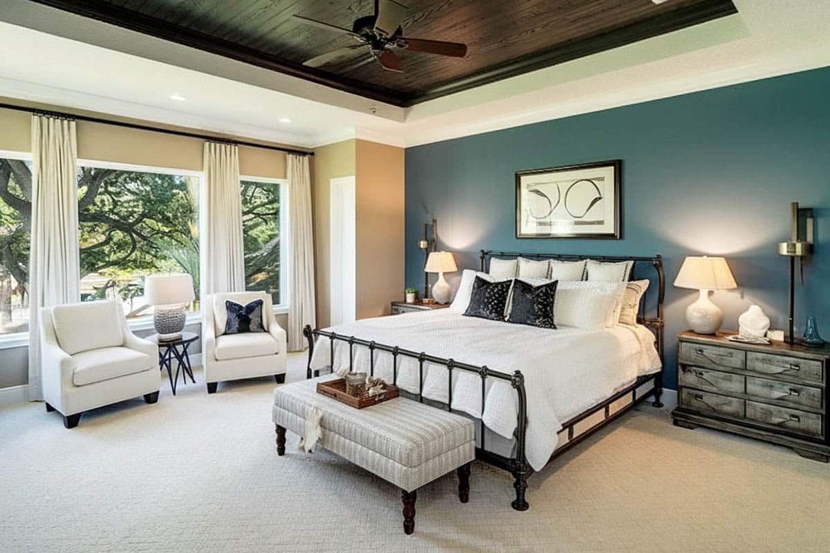 Traditional master bedroom with wood plank ceiling
