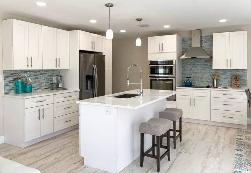 White kitchen with mosaic tile backsplash and wine tray