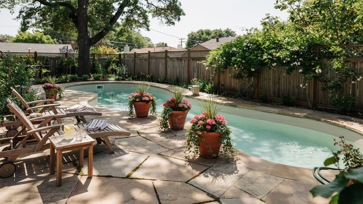 Backyard lazy river pool kit with flagstone decking and flower pots